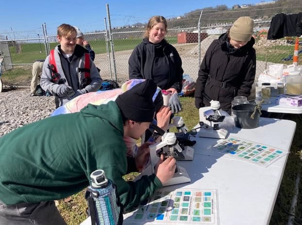 Student analyzing water samples taken from Mill Creek