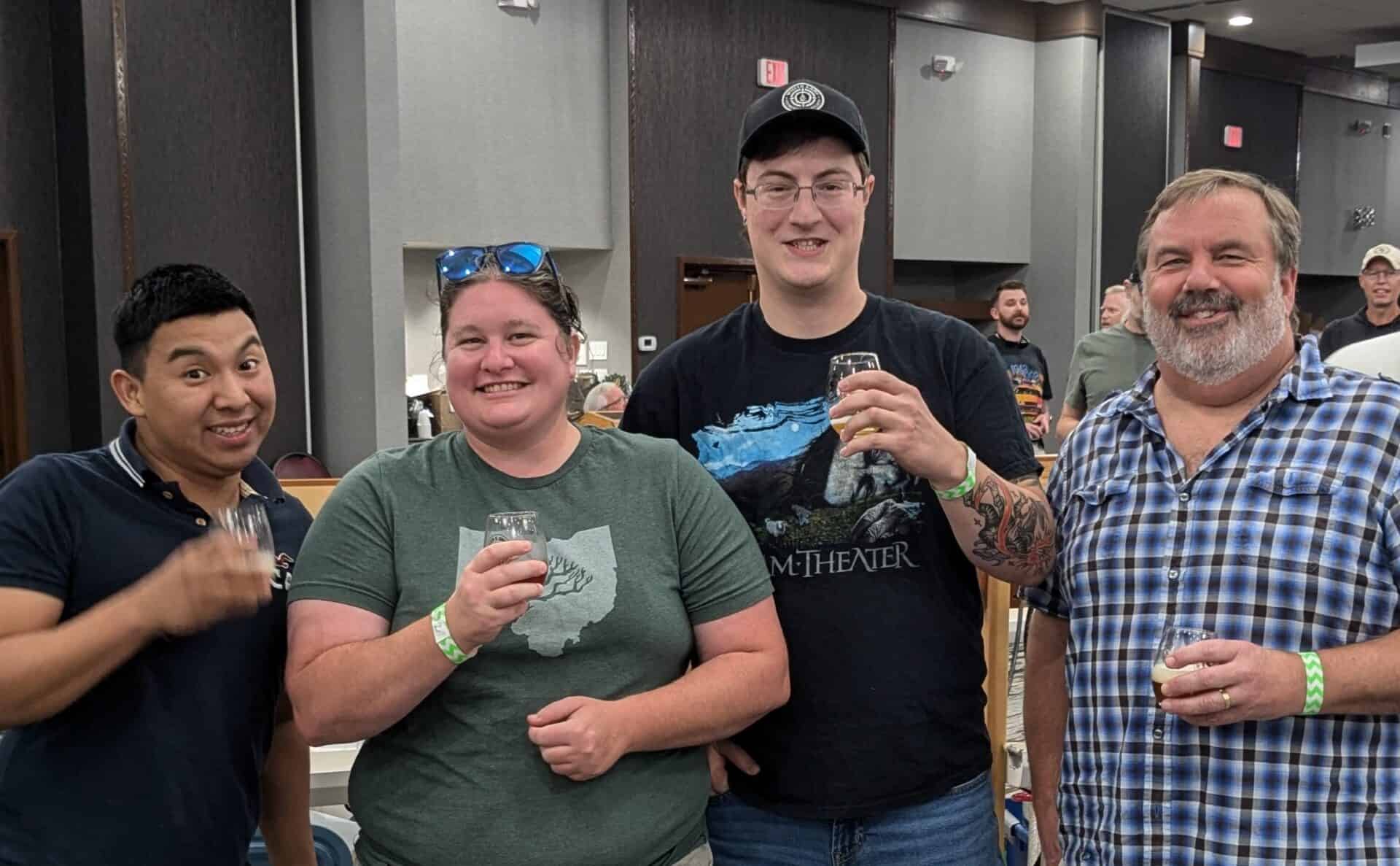 Students Oscar Sanchez, Megan Bowersox, and Joel Davidson, and faculty member Larry Feist celebrated at the Bloatarian Brewing League competition